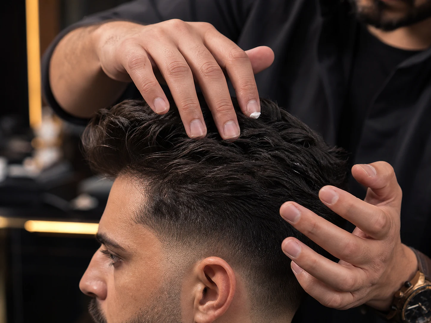 Barber hand-finishing a freshly textured haircut