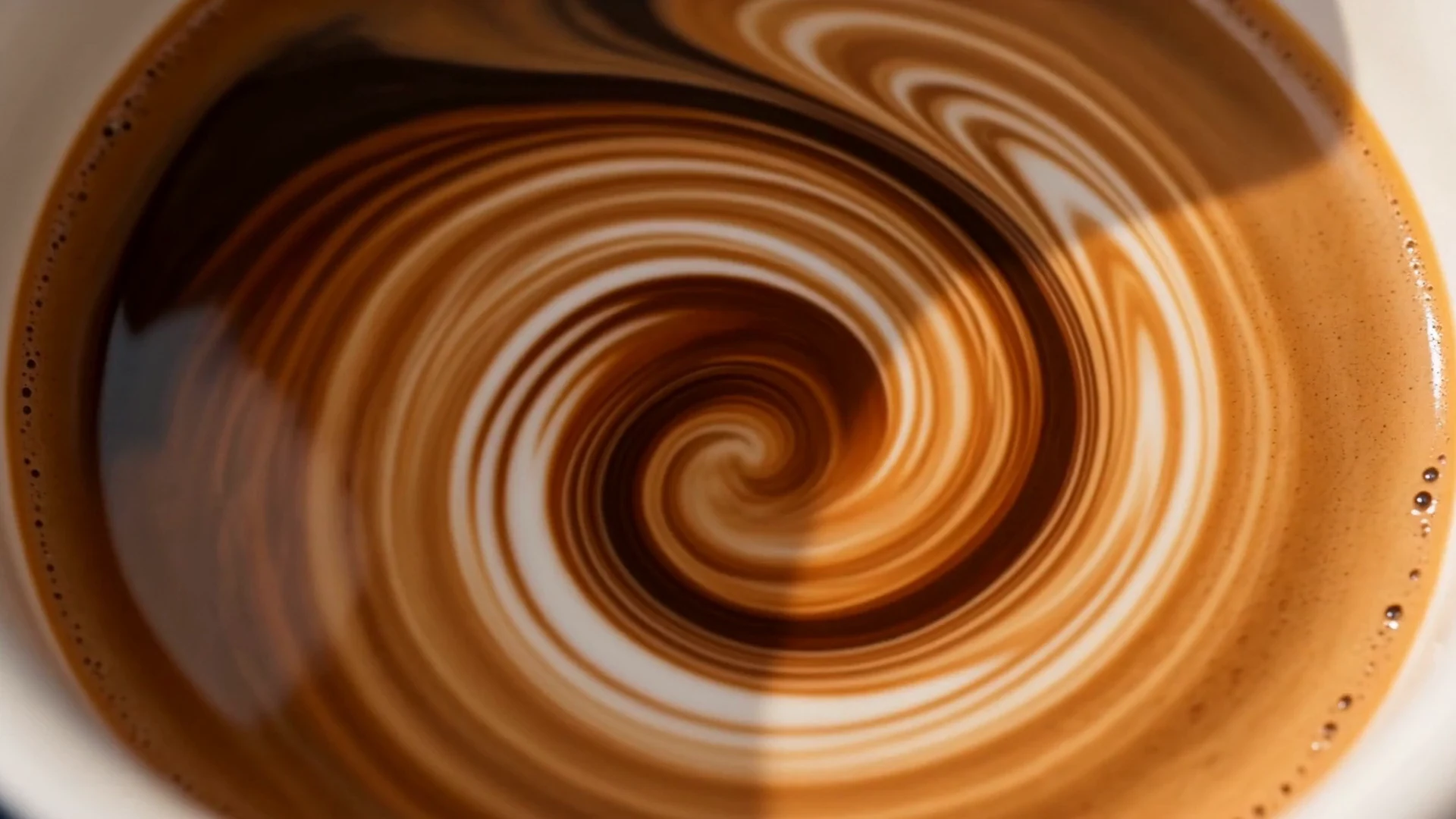 Milk swirling as it is steamed.
