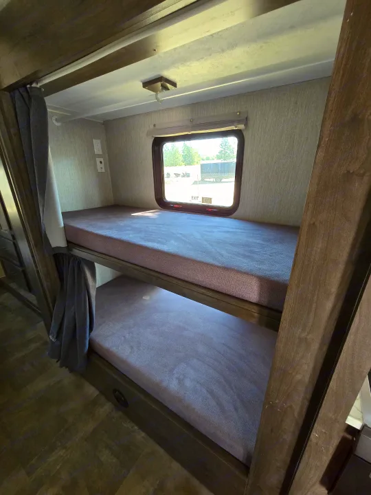 Two built-in bunk beds in the Coachmen Pursuit
